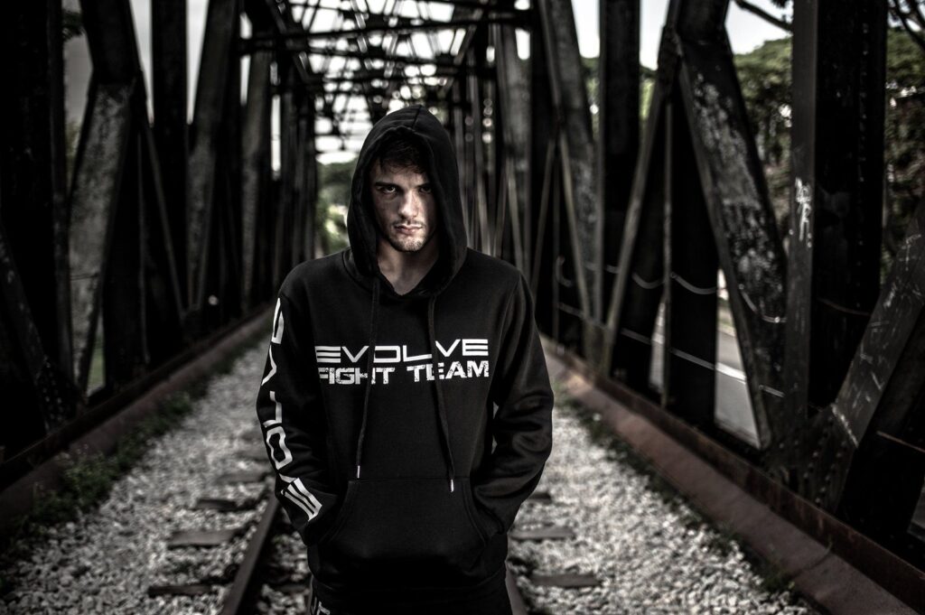 ONE Superstar Bruno Pucci is wearing the Evolve Fight Team hoodie.