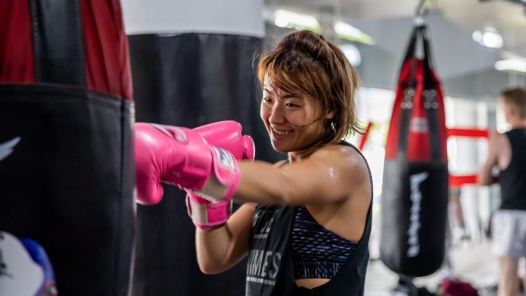 Muay-Thai-Punches-On-Bag(A student punching a heavy bag at Evolve MMA (Far East Square) in Singapore.) 